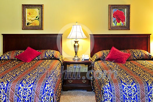 Bedroom interior with two double beds, images on the wall are my own. Bedroom interior with two double beds, images on the wall are my own.