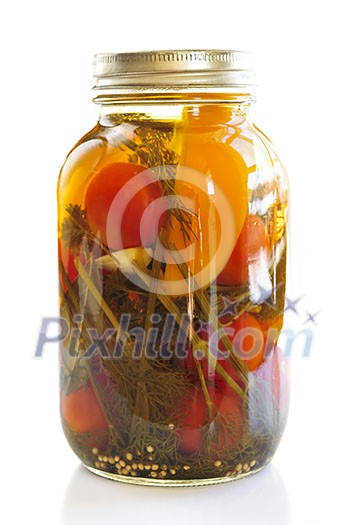 Clear glass jar of colorful pickled vegetables Clear glass jar of colorful pickled vegetables