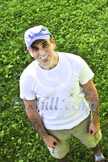 Portrait of a smiling man outdoors on green grass Portrait of a smiling man outdoors on green grass