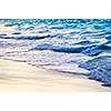 Tropical Caribbean sea waves breaking on the shore