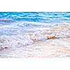 Tropical Caribbean sea waves breaking on the shore