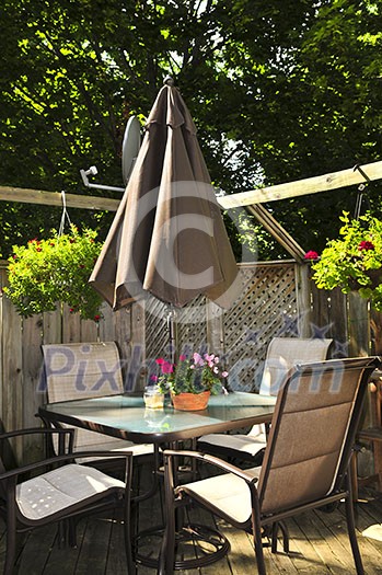 Wooden deck of a house with patio furniture Wooden deck of a house with patio furniture