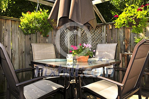 Wooden deck of a house with patio furniture Wooden deck of a house with patio furniture