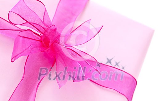 Gift box wrapped in pink paper with ribbon and bow Gift box wrapped in pink paper with ribbon and bow