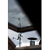 Antennas and a satellite dish on a roof
