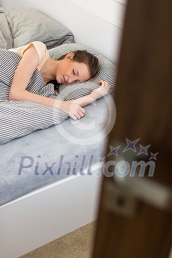 Beautiful young woman sleeping in bed Beautiful young woman sleeping in bed