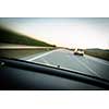 Cars moving fast on a highway (motion blurred image)
