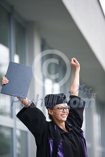 Pretty, young woman celebrating joyfully her graduation - cheking her diploma, happy/impressed with the title she received (color toned image; shallow DOF) Pretty, young woman celebrating joyfully her graduation - cheking her diploma, happy/impressed with the title she received (color toned image; shallow DOF)