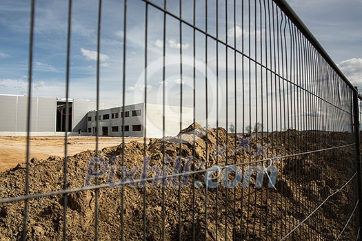 Construction site with a fence around it Construction site with a fence around it