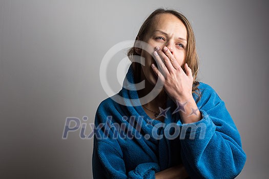 Sleepy young woman with wide open mouth yawning Sleepy young woman with wide open mouth yawning