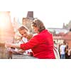 Mother and daughter traveling - two female tourists studying a map, discovering a new city