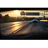 Cars on a highway at sunset (shallow DOF; color toned image)