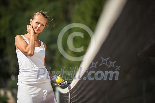 Portrait of a pretty young tennis player with copyspace (shallow DOF; color toned image) Portrait of a pretty young tennis player with copyspace (shallow DOF; color toned image)