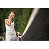 Portrait of a pretty young tennis player with copyspace (shallow DOF; color toned image)