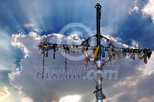 Cross with ribbons against clouds Cross with ribbons against clouds