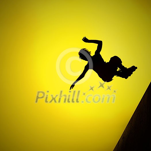 silhouette of roller boy jumping in air silhouette of roller boy jumping in air