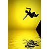 silhouette of roller boy jumping in air