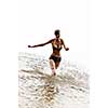 happy girl run in the water