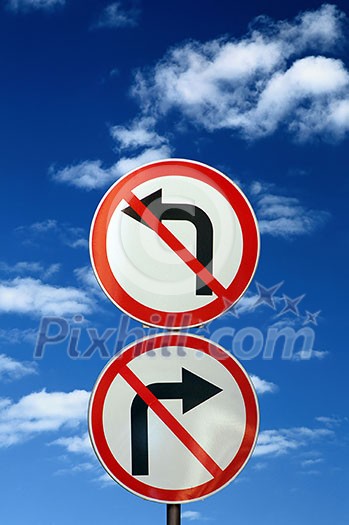 two opposite road signs against blue sky and clouds two opposite road signs against blue sky and clouds