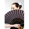 closeup portrait of flamenco dancer with fan 