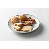 coockies with almond on plate isolated on white