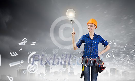 Young pretty woman engineer with tool belt on waist Young pretty woman engineer with tool belt on waist