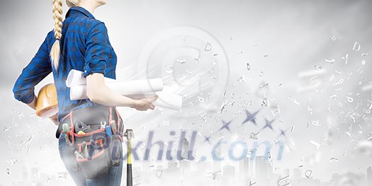 Bottom view of woman engineer with tool belt on waist Bottom view of woman engineer with tool belt on waist
