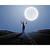 Young screaming man at night with big full moon at background