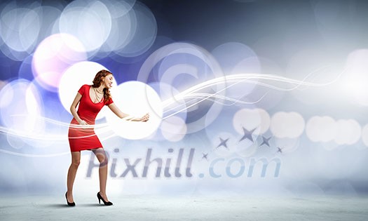 Young woman in red dress playing guitar Young woman in red dress playing guitar