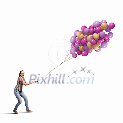 Young woman in casual holding bunch of colorful balloons Young woman in casual holding bunch of colorful balloons