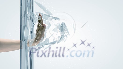 Close up of male hand breaking glass with palm Close up of male hand breaking glass with palm