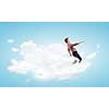 Young man in casual walking on cloud high in sky