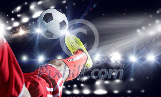 Close up image of footballer foot kicking the ball Close up image of footballer foot kicking the ball