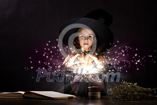 Little Halloween witch reading conjure above pot Little Halloween witch reading conjure above pot