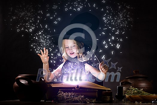 Little Halloween witch reading conjure above pot Little Halloween witch reading conjure above pot