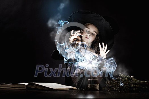 Little Halloween witch reading conjure above pot Little Halloween witch reading conjure above pot