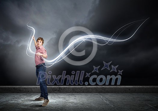 Young man in casual throwing light splashes Young man in casual throwing light splashes