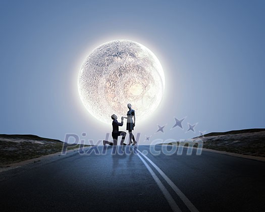 Silhouettes of man making proposal to woman Silhouettes of man making proposal to woman