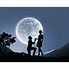 Silhouettes of man making proposal to woman