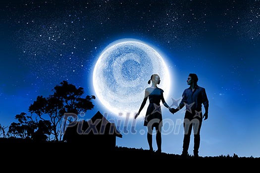 Silhouettes of couple against big moon at background Silhouettes of couple against big moon at background