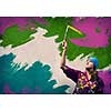 Young woman painting wall in colors with brush