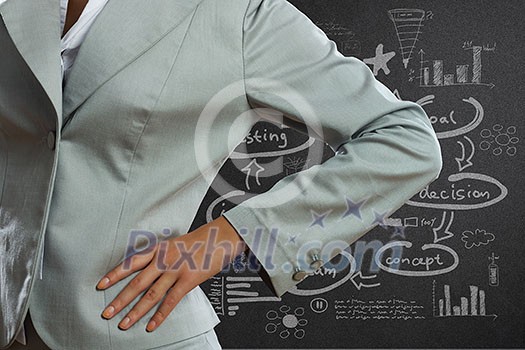 Close up of businesswoman and business sketches at background Close up of businesswoman and business sketches at background