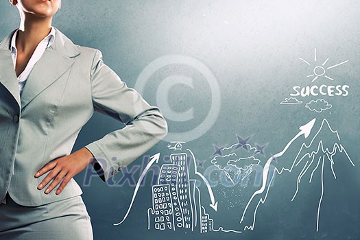 Close up of businesswoman and business sketches on cement wall Close up of businesswoman and business sketches on cement wall