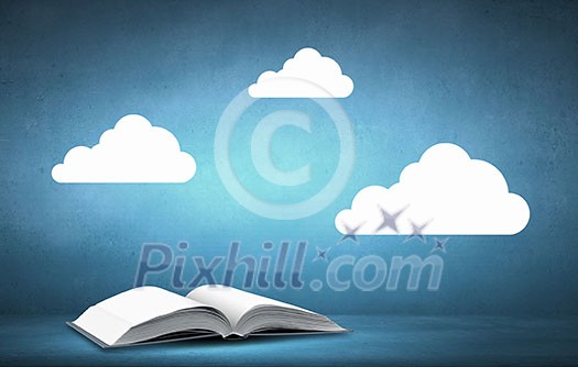 Opened book with white clouds above pages Opened book with white clouds above pages