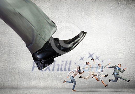 Big businessman foot kicking businesspeople running away Big businessman foot kicking businesspeople running away