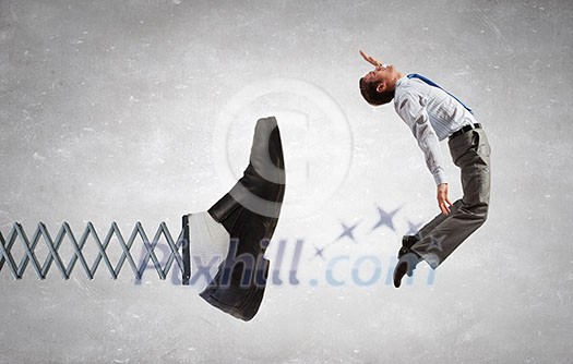 Businessman kicked by his boss foot on spring Businessman kicked by his boss foot on spring