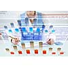 Businessman hand writing with pen and digital business infographs