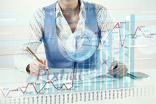 Businessman hand writing with pen and digital business infographs Businessman hand writing with pen and digital business infographs
