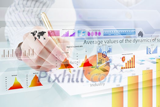 Businessman hand writing with pen and digital business infographs Businessman hand writing with pen and digital business infographs
