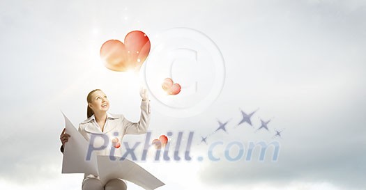 Portrait of young businesswoman in white suit reading blank newspaper Portrait of young businesswoman in white suit reading blank newspaper